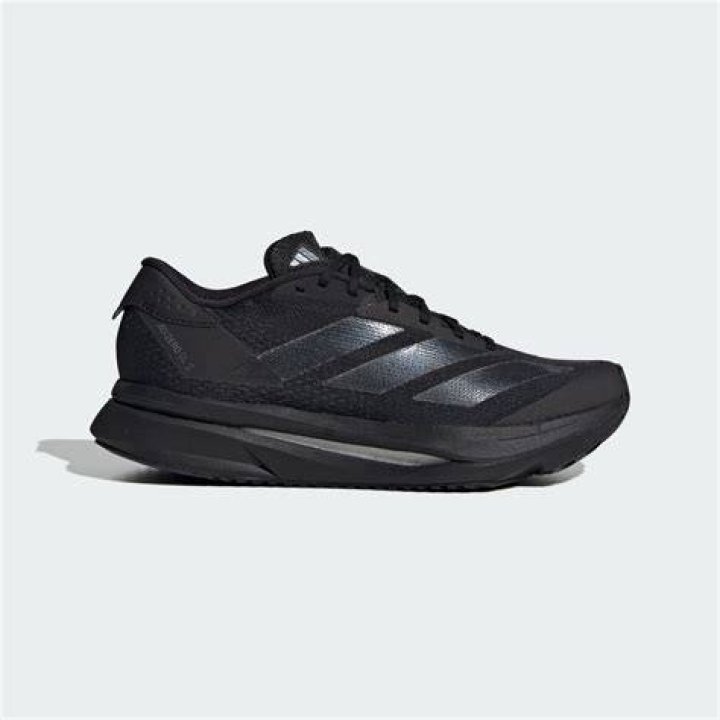 A black running shoe with white and orange accents.