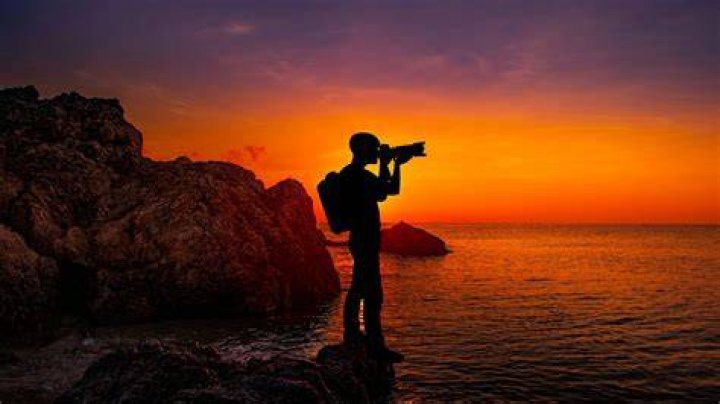 A photographer on top of a hill