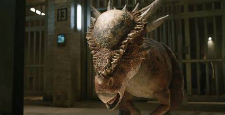 A Stygimoloch rams through a jail cell in Jurassic World: Fallen Kingdom