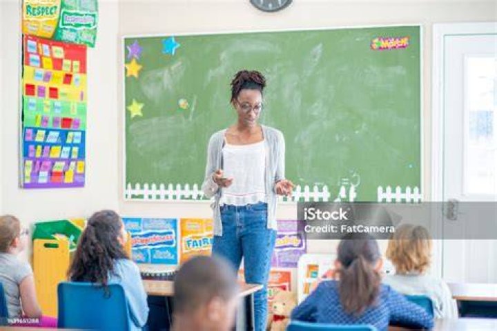 A teacher instructing her class