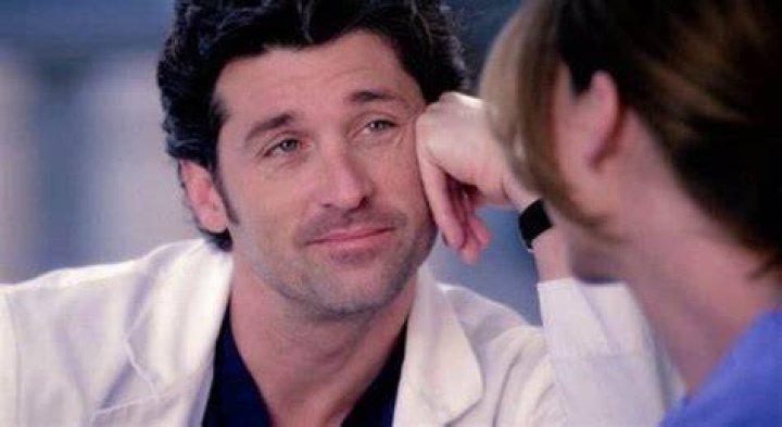 An image of Derek looking through a window of a car in Grey's Anatomy