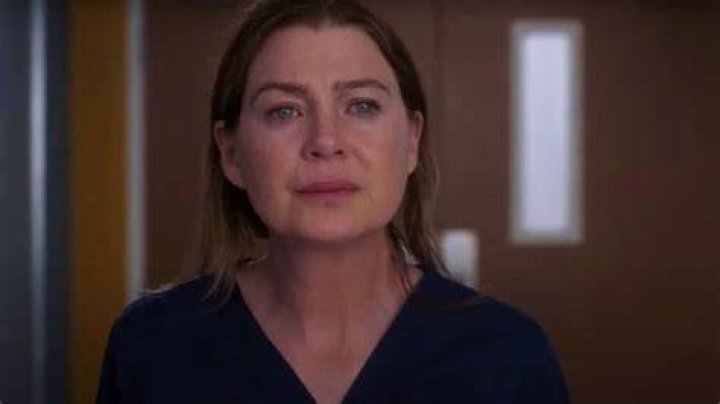 An image of Meredith standing in front of a house of candles in Grey's Anatomy