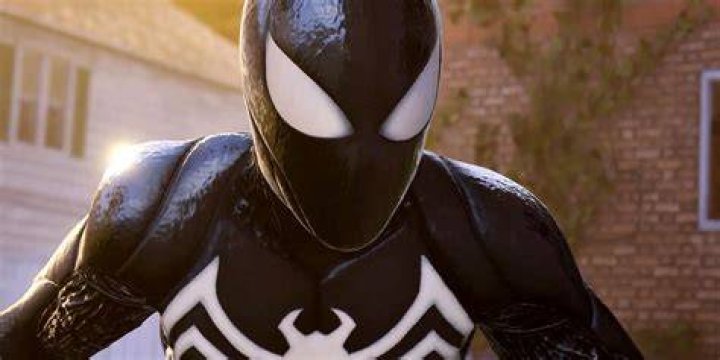 An image of Venom, Peter with the symbiote suit, and Carnage in the background. 