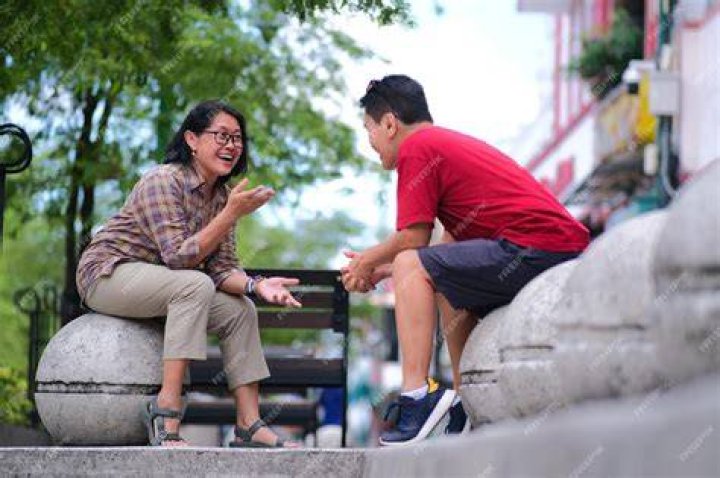 Asian man and woman sitting at a table