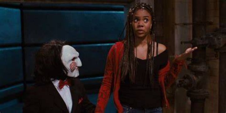 Brenda holding Zoltar's hand in Scary Movie 4