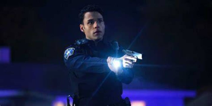 Carlos points his gun in 911 Lone Star 