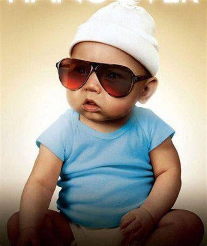 Carlos the baby sitting at a table in The Hangover