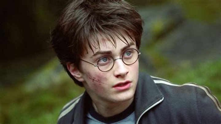 Daniel Radcliffe as Harry Potter and David Bradley as Filch in The Chamber of Secrets