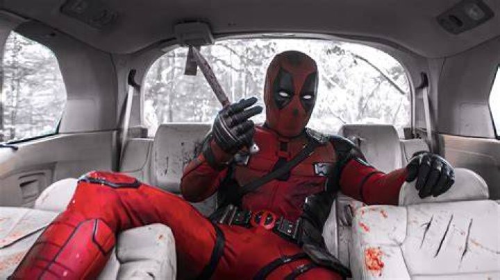 Deadpool sitting in front of Colossus in his movie.