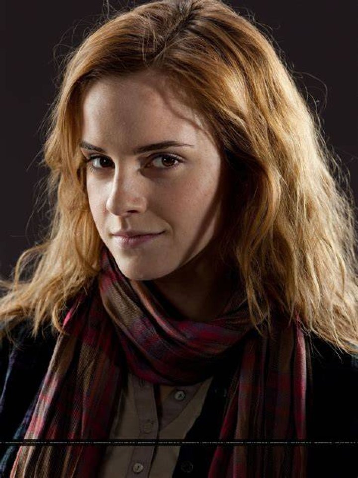Emma Watson As Hermione Granger Reading A Book in Harry Potter