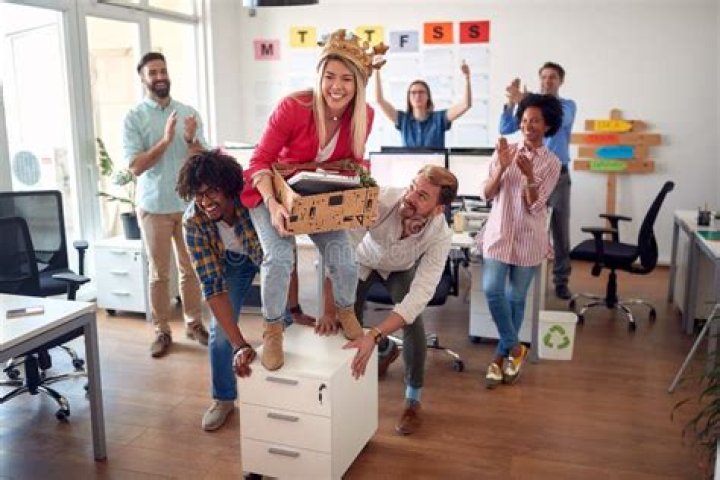 employees having fun with their dog office pet