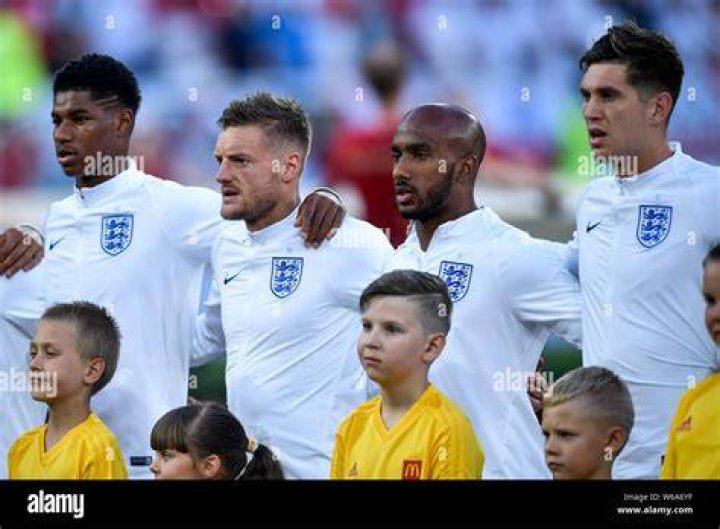 England players sing their national anthem ahead of their FIFA World Cup R16 match against Senegal