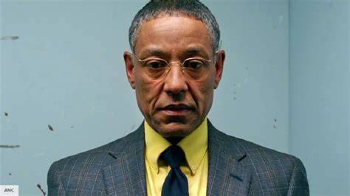 Giancarlo Esposito in character as Moff Gideon in The Mandalorian smirking