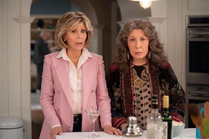 Grace and Frankie stare at each other in the kitchen in Grace and Frankie