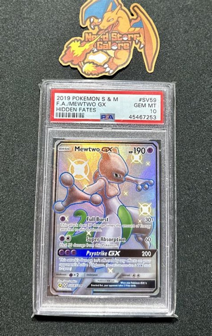 Graded Pok&eacute;mon cards from PSA, Beckett, and CGC over the Crown Zenith expansion promo banner.