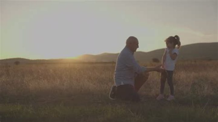 Grandpa Jackson kneeling down to talk to Lucy in Lucy Shimmers and the Prince of Peace