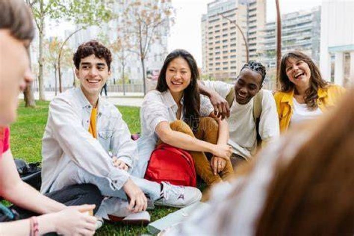 Group of young students hanging out in between classes