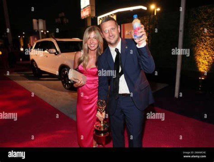 Heather Robinson, left, and Tim Robinson with the Emmy for outstanding