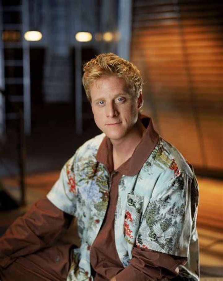 Hoban Washburne with his arms crossed and smiling in Firefly