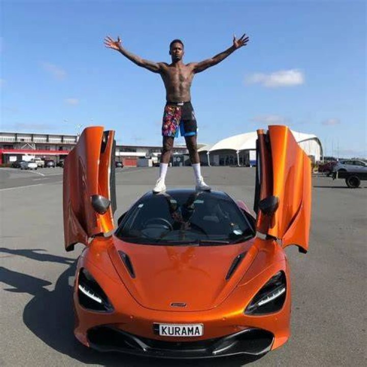 Israel Adesanya with his cars.
