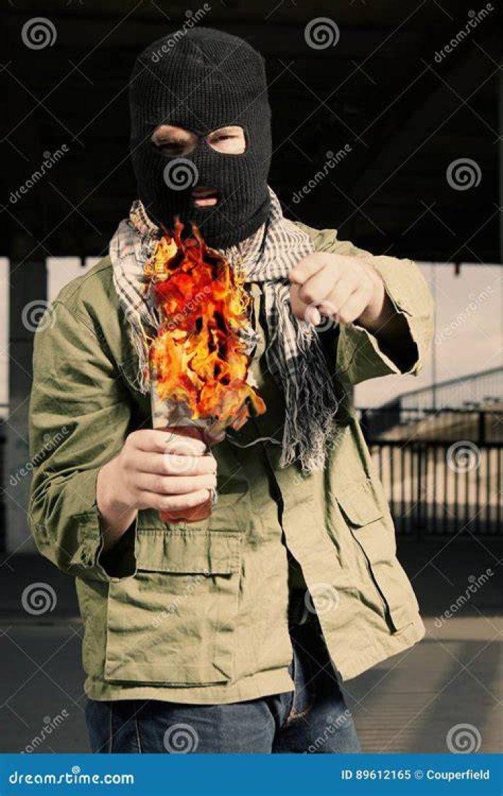 Jason holding a flammable Molotov Cocktail in a bar