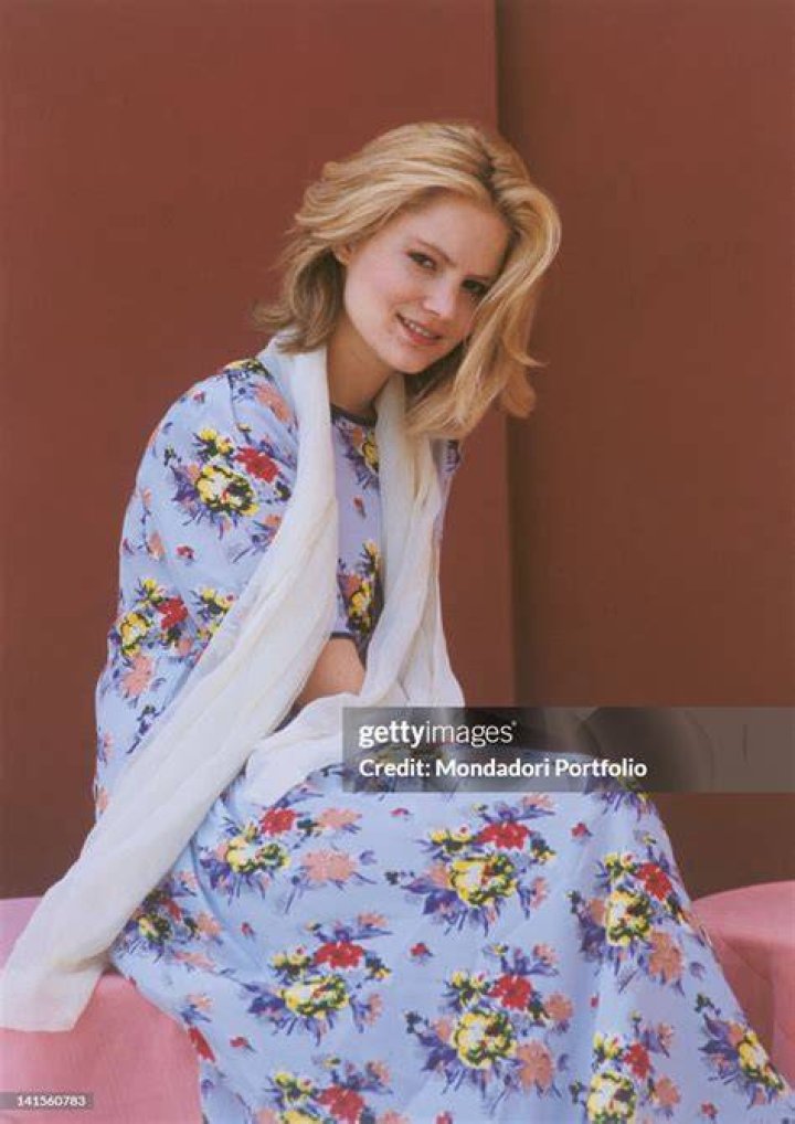Jennifer Jason Leigh sitting at a table in Fargo