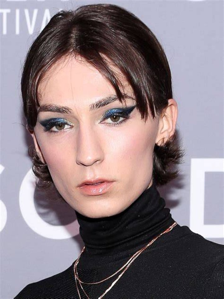 Jesse James Keitel posing at a "Queer as Folk" screening event