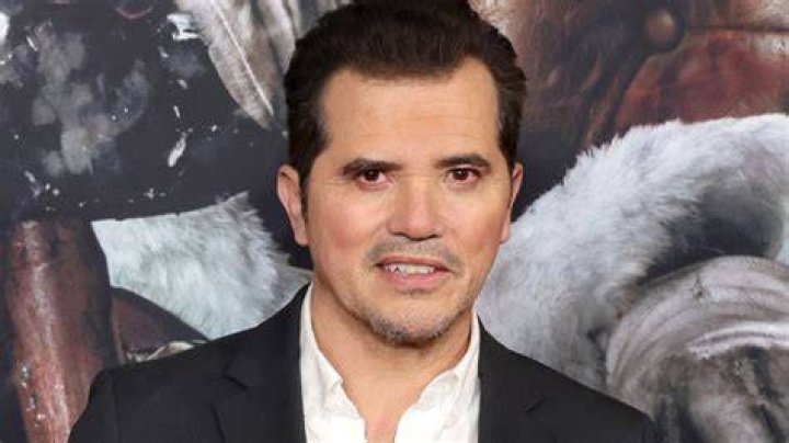 John Leguizamo as Scrooge and David Harbour as Santa in Violent Night