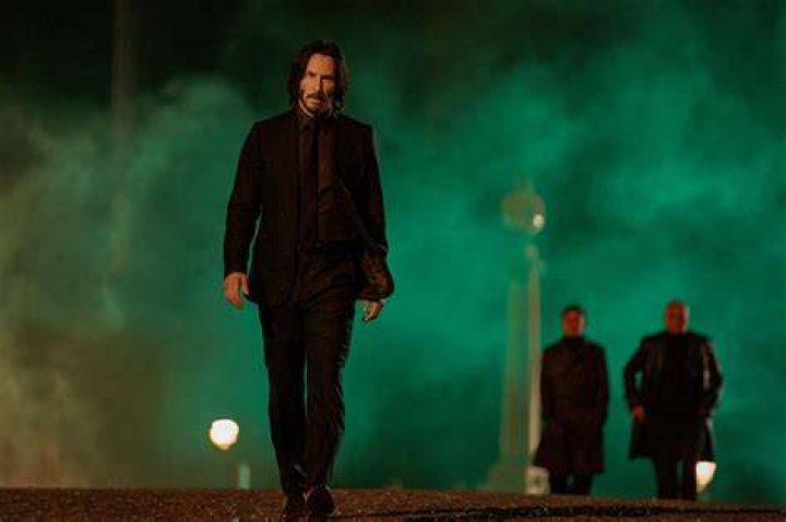 John Wick cradles his dead dog in John Wick