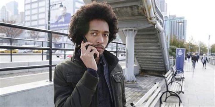 Kory from Manifest outside, talking on his cell phone