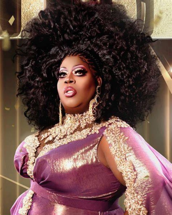 Latrice Royale with her hair up, face close-up, smiling on the stage of RuPaul's Drag Race