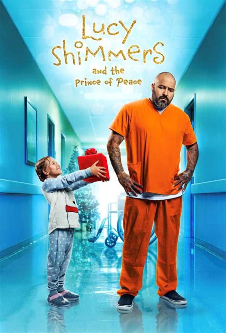 Lucy Shimmers sitting in a wheelchair looking back at her parents and nurses in the hospital in Lucy Shimmers and the Prince of Peace