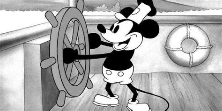 Mickey Mouse steering a steamboat in Steamboat Willie