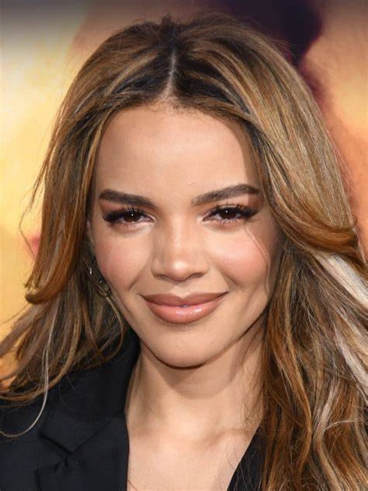Montage of Leslie Grace's Batgirl and Michael Keaton's Batman.