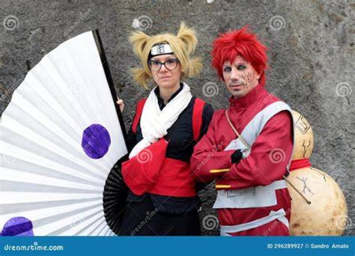 Naruto and Gaara dressed in suits and standing in fighting poses in Ultimate Ninja Storm Revolution