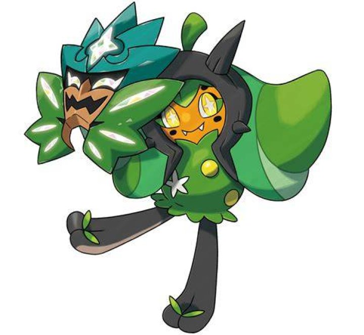 Ogerpon, the green humanoid Pokemon with a teal mask, glowers at the camera. In the background, a hillside at night.