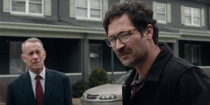 Otto looking at Tommy in A Man Called Otto.