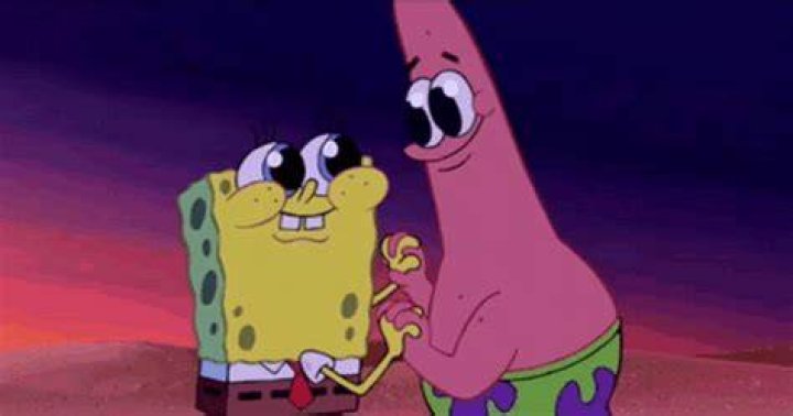 Patrick smiling deviously while Spongebob holds up a snowball