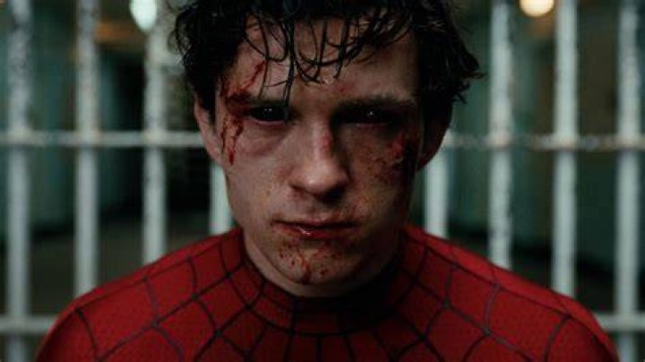 Peter Parker unmasked and talking in Spider-Man Into the Spider-VErse