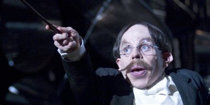Professor Flitwick conducting a Hogwarts choir