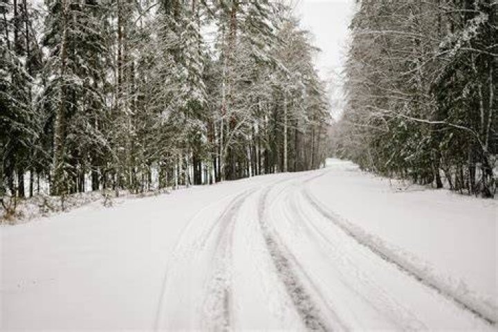Road next to snow covered mountains