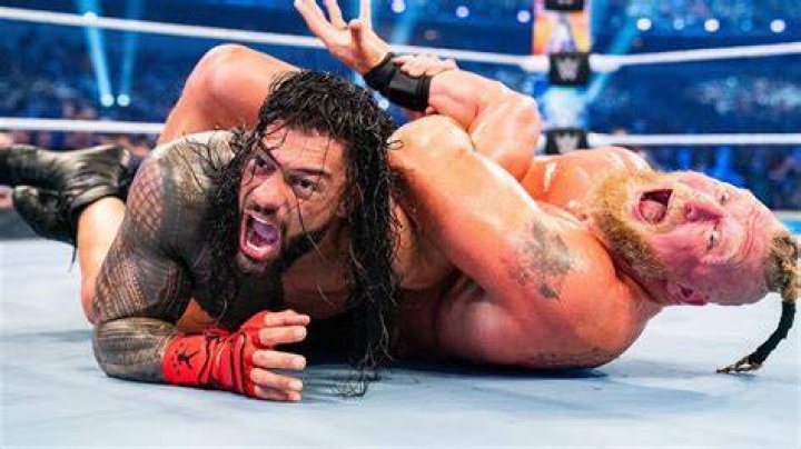 Roman Reigns and Brock Lesnar (on a tractor) at SummerSlam 2022