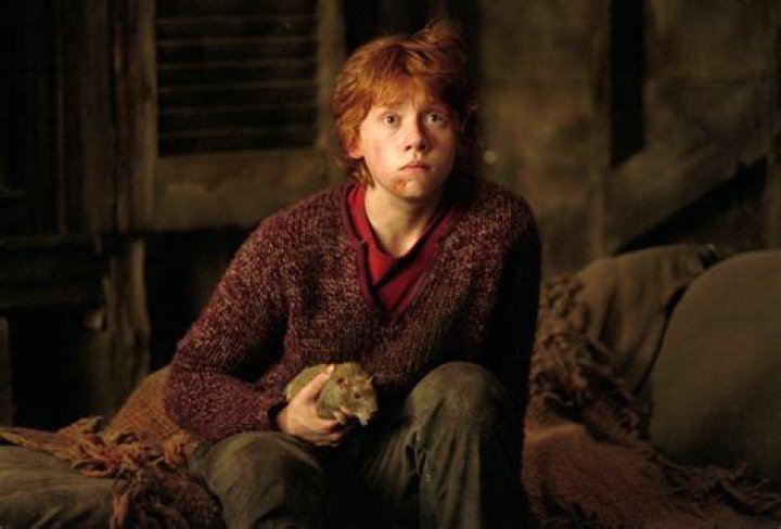 Rupert Grint As Ron Weasley Smiling And Clapping In Hogwarts Uniform in Harry Potter