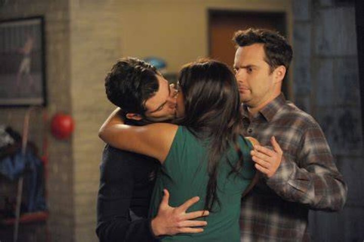 Schmidt giving Nick a kiss