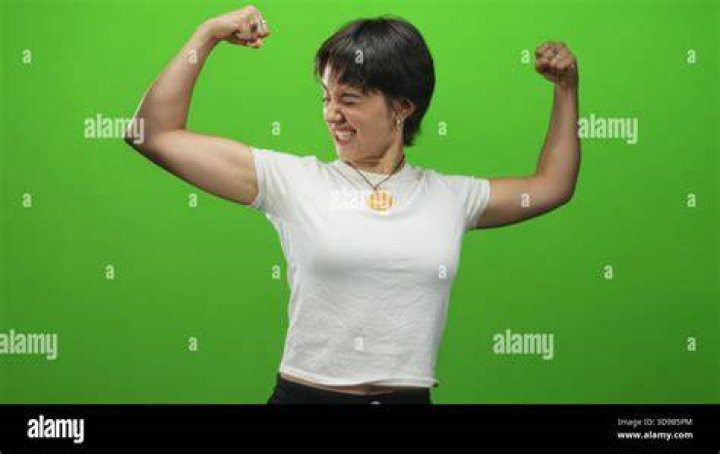 She-Hulk flexes her arms in Marvel Comics.