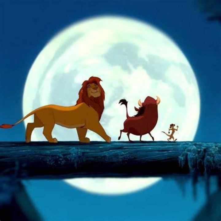 Simba singing with Timon and Pumbaa in the jungle in The Lion King