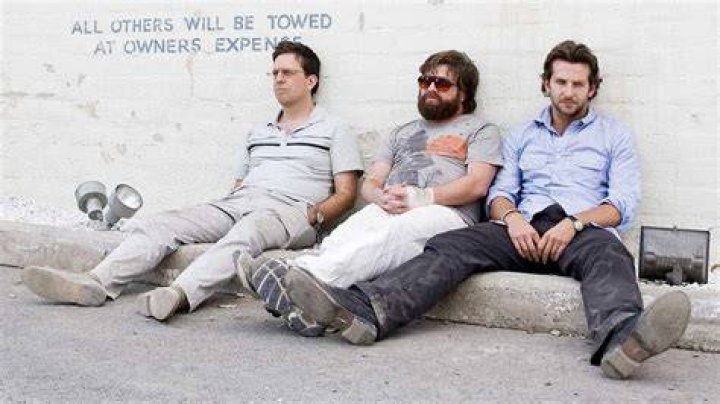 Stu, Alan and Phil sitting on a couch in The Hangover