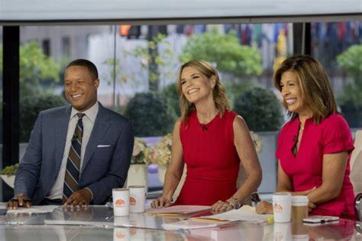 Three hosts from The Today Show in the '90s talking to one another.