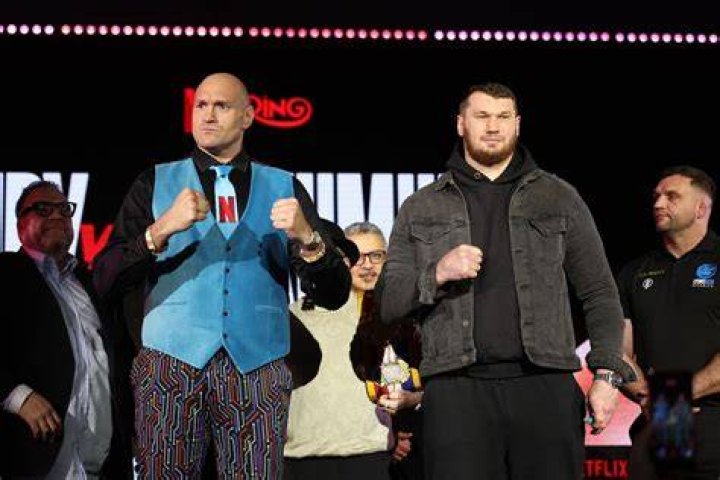 Tyson and Tommy Fury pose together topless