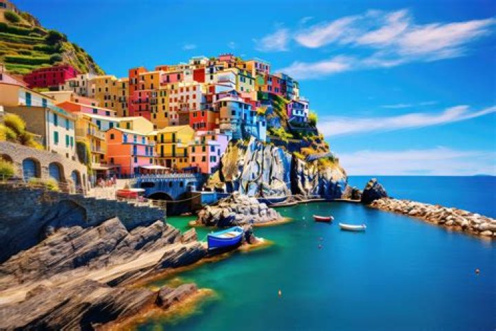 View of colorful Italian buildings and a red Fiat driving on the street